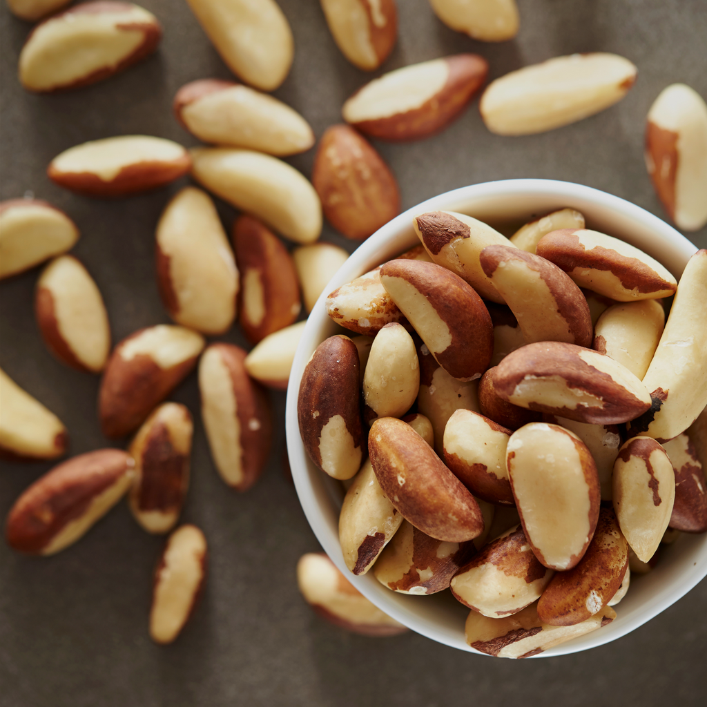 The Brazil nuts have a rich brown outer shell with a creamy white interior.